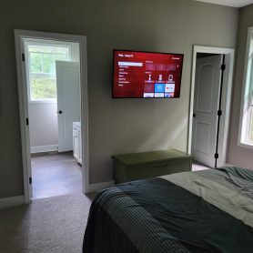 Bedroom and bathroom furnished in our Fletcher home.